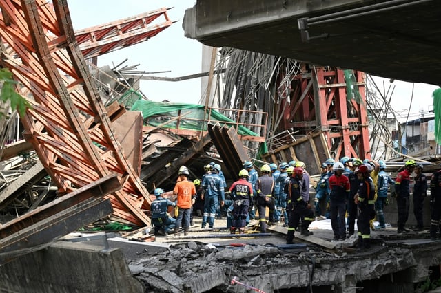 At least four construction workers died at the site, where a tollway was under construction, and dozens were injured, police said