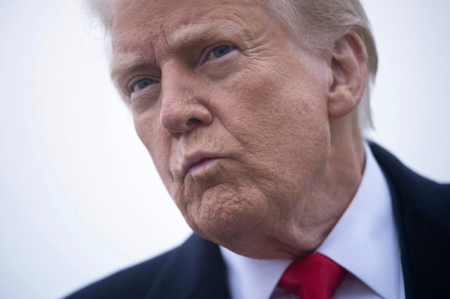 US President Donald Trump speaks to the press about the conflict in Ukraine before boarding Air Force One at Andrews Air Force Base March 14, 2025, in Maryland.