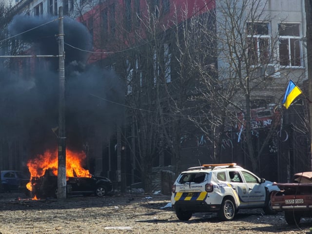 KHERSON, UKRAINE - MARCH 14: (----EDITORIAL USE ONLY - MANDATORY CREDIT - 'KHERSON REGIONAL MILITARY ADMINISTRATION OF UKRAINE / HANDOUT' - NO MARKETING NO ADVERTISING CAMPAIGNS - DISTRIBUTED AS A SERVICE TO CLIENTS---- ) Smoke and flames rise from a car after Russian airstrike on Kherson, Ukraine on March 14, 2025. In the afternoon, Russia dropped a guided aerial bomb on the central part of the city. A medical institution, social infrastructure facilities and shops were damaged as a result of the attack. It was reported that one civilian was injured as a result of the attack. (Photo by Kherson Regional Military Administration / Handout/Anadolu via Getty Images)