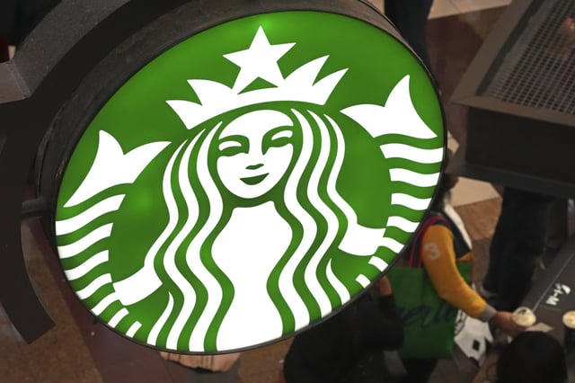 FILE - This is the Starbucks sign on Black Friday shoppers line at a Starbucks kiosk in the Walden Galleria in Buffalo, NY., Friday, Nov. 29, 2024. (AP Photo/Gene J. Puskar)