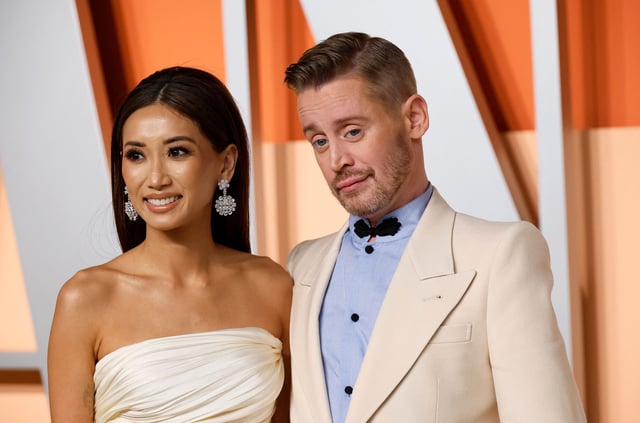 Brenda Song and Macaulay Culkin arrive at the Vanity Fair Oscars party after the 97th Academy Awards, in Beverly Hills, California, March 2, 2025.