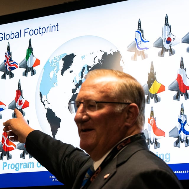 An icon of an F-35 with a Canadian flag is seen on a screen as Lockheed Martin’s J.R. McDonald speaks during a news conference at the CANSEC trade show, in Ottawa, Wednesday, June 1, 2022. THE CANADIAN PRESS/Justin Tang