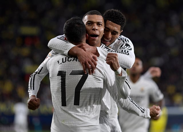 Soccer Football - LaLiga - Villarreal v Real Madrid - Estadio de la Ceramica, Villarreal, Spain - March 15, 2025 Real Madrid's Kylian Mbappe celebrates scoring their second goal with Lucas Vazquez and Jude Bellingham REUTERS/Pablo Morano