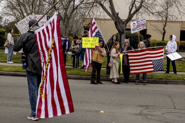 Protesters rally against Tesla CEO Elon Musk and President Donald Trump and Tesla CEO Elon Musk outside the Tesla showroom in Santa Rosa on Saturday. 