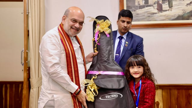Union Home Minister Amit Shah, during his visit to the Northeast on Saturday, gifted a guitar to 7-year-old Mizoram prodigy Esther Lalduhawmi Hnamte.