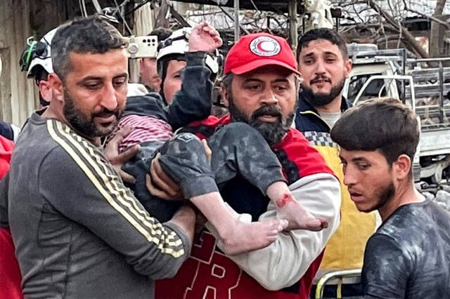 Rescue workers dug out people trapped after a building collapsed in an explosion