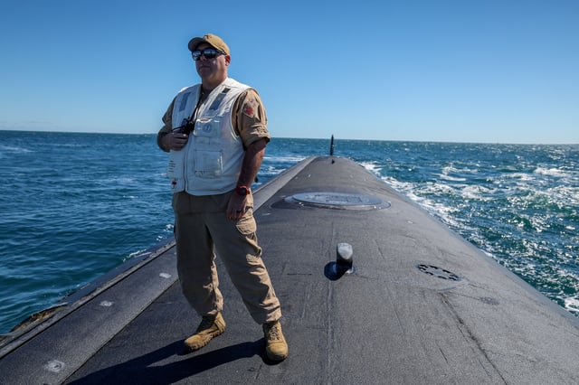 Master Chief Missile Technician Kevin Lewis Minnesota Chief of the Boat on the stern (white lifejacket) of Virginia-class fast attack submarine USS Minnesota (SSN-783) off the coast of Western Australia, Australia March 16, 2025.  COLIN MURTY/Pool via REUTERS