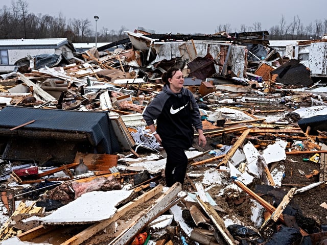 POPLAR BLUFF, MISSOURI - MARCH 15: Stevie Kara searches for personal items after her home was destroyed on March 15, 2025 in Poplar Bluff, Missouri. Kara was at home when the storm came through and woke up on the ground needing stitches in her hand and leg. Many homes throughout Harmony Hills were damaged by the severe weather on Friday night that left one person dead in Butler County, Missouri. At least 19 people have reportedly been killed after tornadoes and severe storms hit several midwest and southern states overnight. (Photo by Brad Vest/Getty Images)