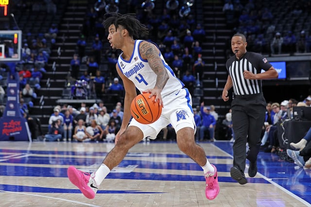 PJ Haggerty #4 of the Memphis Tigers handles the ball during the game against the Temple Owls at FedExForum on February 09, 2025 in Memphis, Tennessee.