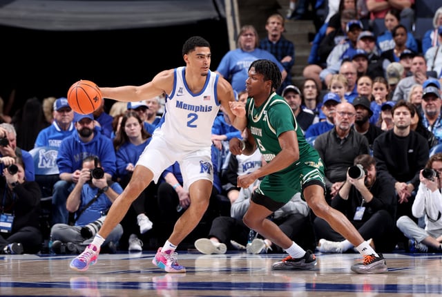 Nicholas Jourdain #2 of the Memphis Tigers dribbles the ball against Brandon Stroud of the South Florida Bulls during the first half on March 7, 2025 at FedExForum in Memphis, Tennessee.