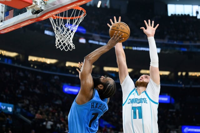 Los Angeles Clippers guard James Harden (1) shoots while under pressure from Charlotte Hornets center Jusuf Nurkic (11) during the first half of an NBA basketball game Sunday, March 16, 2025, in Inglewood, Calif. (AP Photo/William Liang)