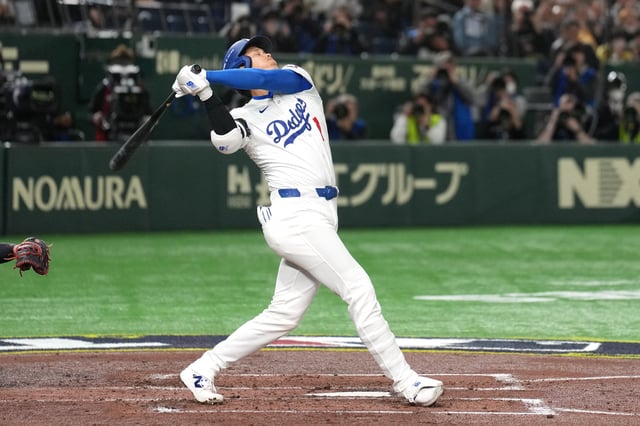 Mar 16, 2025; Bunkyo, Tokyo, Japan; Los Angeles Dodgers designated hitter Shohei Ohtani (17) bats during the third inning against the Hanshin Tigers at Tokyo Dome. Mandatory Credit: Darren Yamashita-Imagn Images