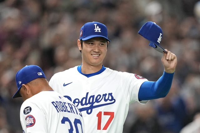 Mar 16, 2025; Bunkyo, Tokyo, Japan; Los Angeles Dodgers designated hitter Shohei Ohtani (17) gestures before the game against the Hanshin Tigers at Tokyo Dome. Mandatory Credit: Darren Yamashita-Imagn Images