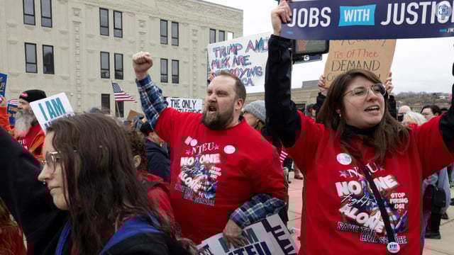 Federal workers shout chants during a rally across the street from the Internal Revenue Service (IRS) headquarters, in support of the civil service in the wake of mass firings, and organized by the National Treasury Employees Union (NTEU) in Kansas City, Missouri, U.S. March 15, 2025.