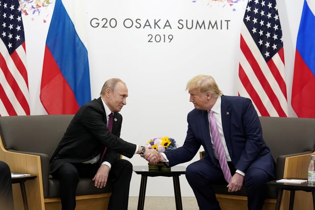 Russia's President Vladimir Putin and U.S. President Donald Trump shake hands during a bilateral meeting at the G20 leaders summit in Osaka, Japan, June 28, 2019.  REUTERS/Kevin Lamarque/File Photo