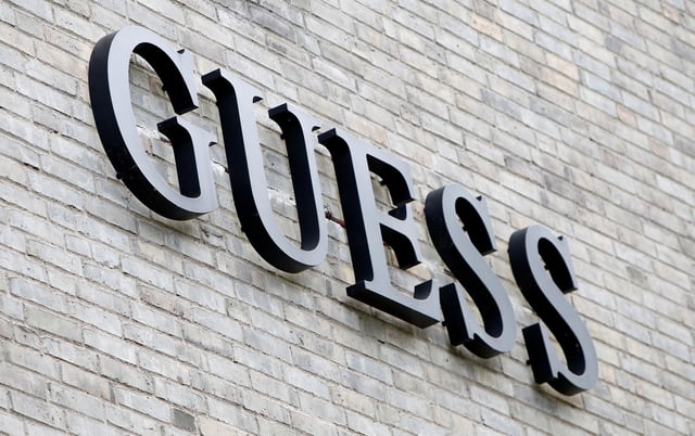 The logo of Guess is seen on an outlet store in Metzingen, Germany, June 16, 2017.  REUTERS/Michaela Rehle/File Photo