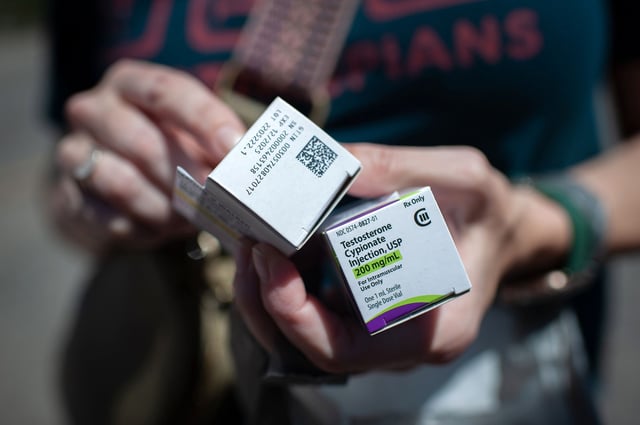 THOMASVILLE, AL - MAY 4: Katie holds Raymond's testosterone supply after successfully filling his prescription at Walgreens in Thomasville, Ala. on May 4, 2023. (Photo by Rory Doyle for The Washington Post via Getty Images)