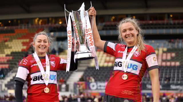 Hunt, left, and Aldcroft lift the PWR trophy after Gloucester-Hartpury won their third successive title on Sunday