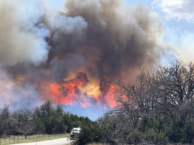 The Crabapple Fire near Fredericksburg had burned about 9,700 acres as of Monday morning, according to officials. 