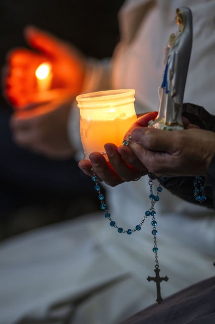Nuns pray the rosary in St. Peter's Square at The Vatican, Sunday, Mar. 16, 2025, for the health of Pope Francis hospitalized at Agostino Gemelli Polyclinic in Rome where he is being treated for bilateral pneumonia since Feb.14. (AP Photo/Domenico Stinellis)