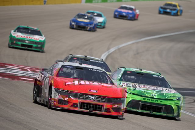 Cole Custer, driver of the #41 HaasTooling.com Ford, races Christopher Bell, driver of the #20 Interstate Batteries Toyota, during the NASCAR Cup Series Pennzoil 400 at Las Vegas Motor Speedway on March 16, 2025 in Las Vegas, Nevada.