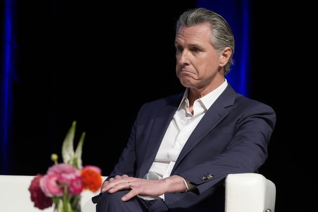 FILE - California Gov. Gavin Newsom holds a fireside chat with Stephen Cheung, the President and Chief Executive Officer of the Los Angeles County Economic Development Corporation (LAEDC) and its subsidiary, the World Trade Center Los Angeles (WTCLA) at the 2025 Economic Forecast and Industry Outlook convening on Wednesday, Feb. 26, 2025, at the East LA College in Los Angeles. (AP Photo/Damian Dovarganes, File)