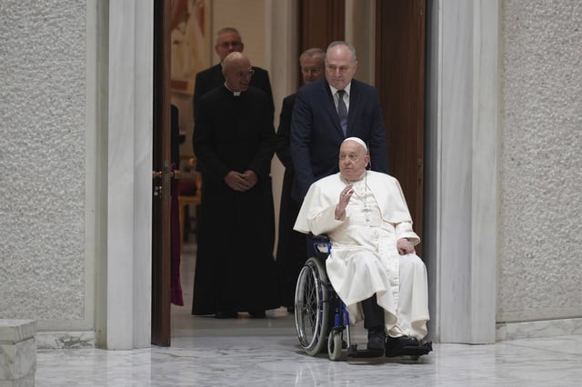 FILE - Pope Francis arrives for his weekly general audience in the Paul VI Hall, at the Vatican, Wednesday, Feb. 12, 2025. (AP Photo/Alessandra Tarantino, File)