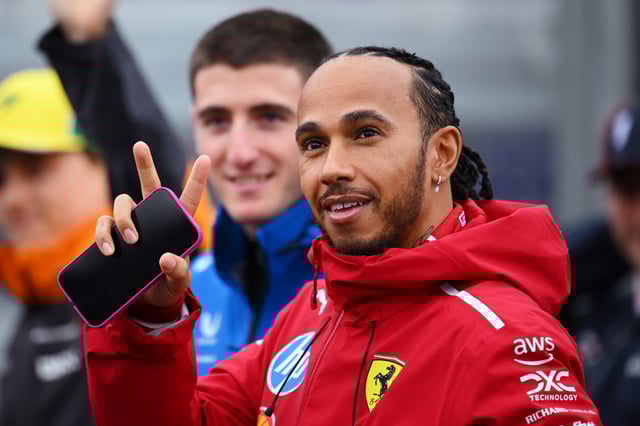 Lewis Hamilton of Great Britain and Scuderia Ferrari waves to the crowd on the drivers parade prior to the F1 Grand Prix of Australia at Albert Park Grand Prix Circuit on March 16, 2025 in Melbourne, Australia.