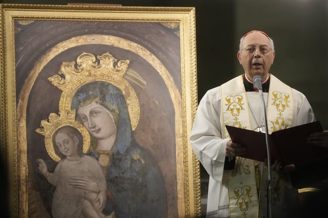 Cardinal Dominique Mamberti prays in St. Peter's Square, at the Vatican, during a vigil rosary for the recovery of Pope Francis, Monday, March 17, 2025. (AP Photo/Gregorio Borgia)