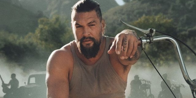 Jason Momoa sitting on a motorcycle