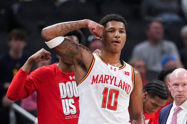 Maryland forward Julian Reese (10) flexes on the bench against Illinois during the first half of an NCAA college basketball game in the quarterfinals of the Big Ten Conference tournament in Indianapolis, Friday, March 14, 2025. (AP Photo/Michael Conroy)