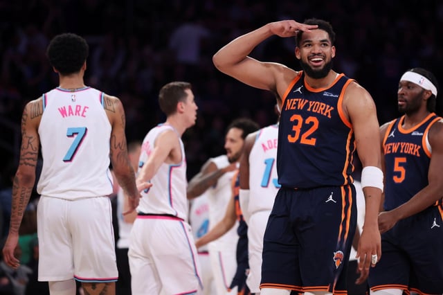 New York Knicks center Karl-Anthony Towns (32) reacts after scoring a 3-point basket during the first half of an NBA basketball game against the Miami Heat, Monday, March 17, 2025, in New York. (AP Photo/Heather Khalifa)