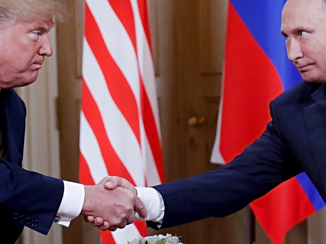 U.S. President Donald Trump, left, and Russian President Vladimir Putin, right, shake hand at the beginning of a meeting at the Presidential Palace in Helsinki, Finland, Monday, July 16, 2018. (AP Photo/Pablo Martinez Monsivais)