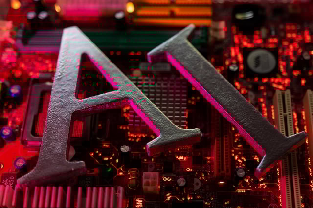 AI (Artificial Intelligence) letters are placed on computer motherboard in this illustration taken, June 23, 2023. REUTERS/Dado Ruvic/Illustration
