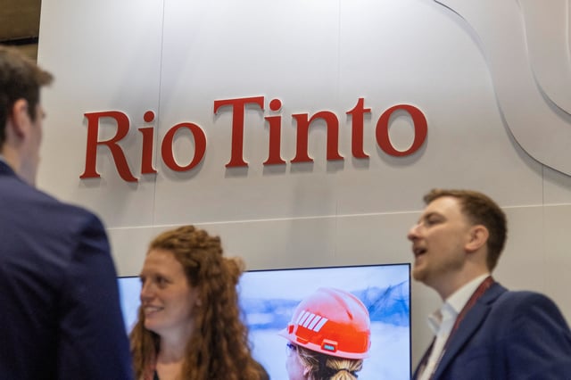 Attendees speak with representatives at the Rio Tinto booth at the Prospectors and Developers Association of Canada (PDAC) annual mining conference in Toronto, Ontario, Canada March 3, 2025.  REUTERS/Carlos Osorio/File Photo