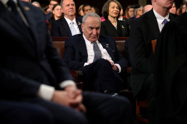 Senate Minority Leader Chuck Schumer listens as President Donald Trump addresses a joint session of Congress at the US Capitol on March 4 in Washington, DC.