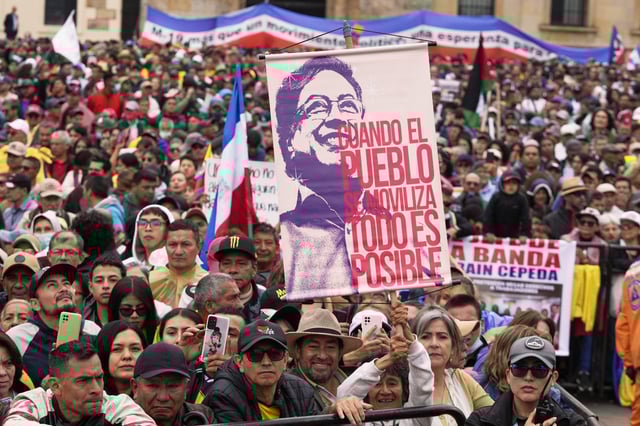 Supporters of President Gustavo Petro rally during a march he called to back his labor and health reform proposals, which have struggled to gain legislative approval, outside Congress in Bogotá, Colombia, Tuesday, March 18, 2025. (AP Photo/Fernando Vergara)