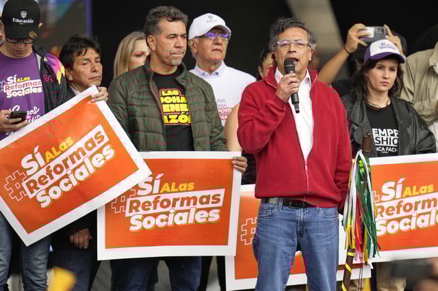 President Gustavo Petro addresses supporters during a rally he called to back his labor and health reform proposals, which have struggled to gain legislative approval, outside Congress in Bogotá, Colombia, Tuesday, March 18, 2025. (AP Photo/Fernando Vergara)