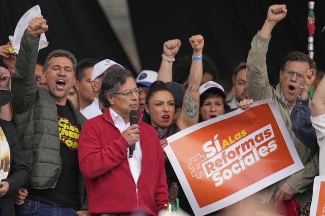 President Gustavo Petro addresses supporters during a rally he called to back his labor and health reform proposals, which have struggled to gain legislative approval, outside Congress in Bogotá, Colombia, Tuesday, March 18, 2025. (AP Photo/Fernando Vergara)