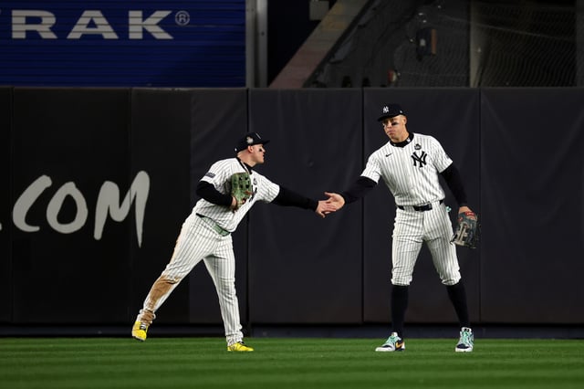 NEW YORK, NY - OCTOBER 29: Alex Verdugo #24 high fives Aaron Judge #99 of the New York Yankees during the World Series game against the Los Angeles Dodgers at Yankee Stadium on October 29, 2024, in New York, New York.