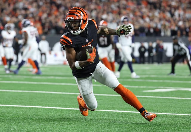 Ja&#39;Marr Chase #1 of the Cincinnati Bengals runs with the ball during the fourth quarter against the Denver Broncos at Paycor Stadium on December 28, 2024.