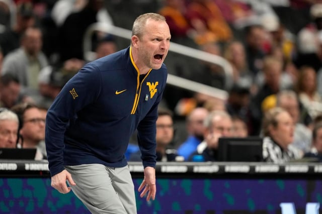 West Virginia head coach Darian Devries yells from the sidelines during the first half of an NCAA college basketball game against the Colorado in the second round of the Big 12 Conference tournament, Wednesday, March 12, 2025, in Kansas City, Mo. (AP Photo/Charlie Riedel)