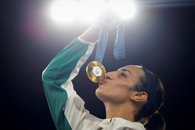 Paris 2024 Olympics - Boxing - Women's 66kg - Victory Ceremony - Roland-Garros Stadium, Paris, France - August 09, 2024. Gold medallist Imane Khelif of Algeria kisses her medal. REUTERS/Peter Cziborra