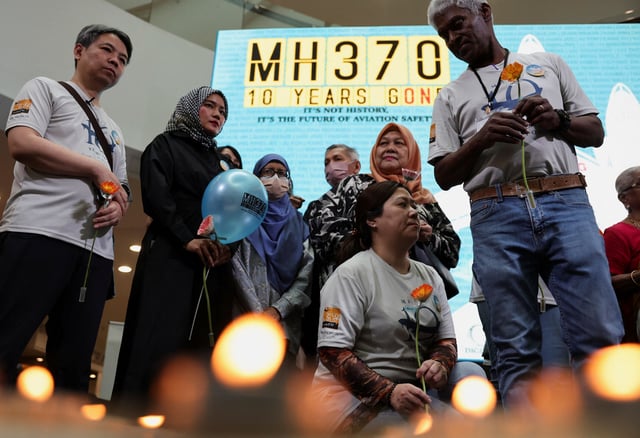 Families of passengers from both China and Malaysia, who were aboard the missing Malaysia Airlines flight MH370, are seen during a remembrance event commemorating the 10th anniversary of its disappearance, in Subang Jaya, Malaysia March 3, 2024. REUTERS/Hasnoor Hussain/File Photo