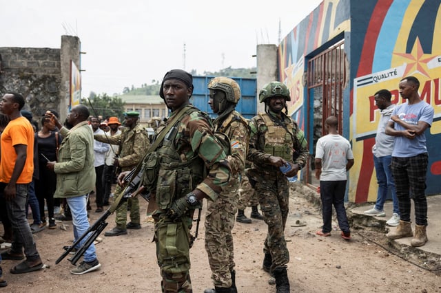 M23 rebels stand guard during a meeting organised by the M23 at the Stade de l'Unite, after the town of Goma was taken by the M23 rebels, in Goma, Democratic Republic of Congo, February 6, 2025. REUTERS/Arlette Bashizi/File Photo