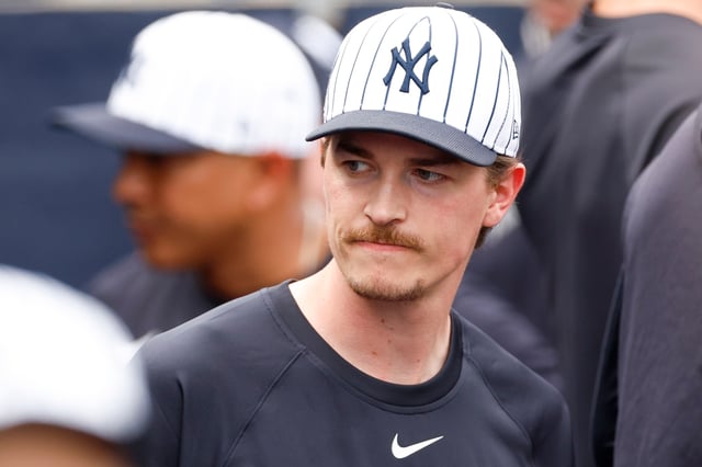 TAMPA, FLORIDA - MARCH 1: Max Fried #54 of the New York Yankees looks on in the dugout in the third inning during a spring training game against the Houston Astros at George M. Steinbrenner Field on March 1, 2025 in Tampa, Florida.