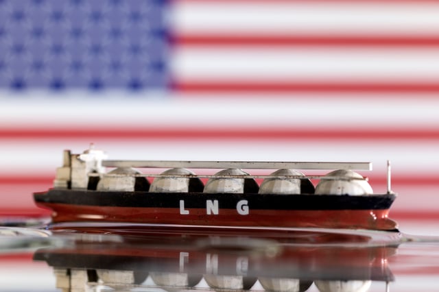 Model of LNG tanker is seen in front of the U.S. flag in this illustration taken May 19, 2022. REUTERS/Dado Ruvic/Illustration
