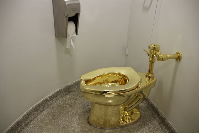 The fully functional &#39;America&#39; toilet made from 18-karat gold has been opened in the Guggenheim Museum in Manhattan, New York City, USA, 16 September 2016. The toilet can and is to be used, but was also designed to be an artwork by Italian artist Maurizio Cattelan. Photo: CHRISTINA HORSTEN/dpa | usage worldwide   (Photo by Christina Horsten/picture alliance via Getty Images)