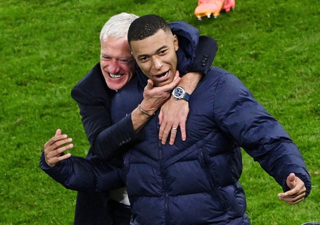 Soccer Football - Euro 2024 - Quarter Final - Portugal v France - Hamburg Volksparkstadion, Hamburg, Germany - July 5, 2024 France coach Didier Deschamps celebrates with Kylian Mbappe after winning the penalty shootout REUTERS/Annegret Hilse/File Photo