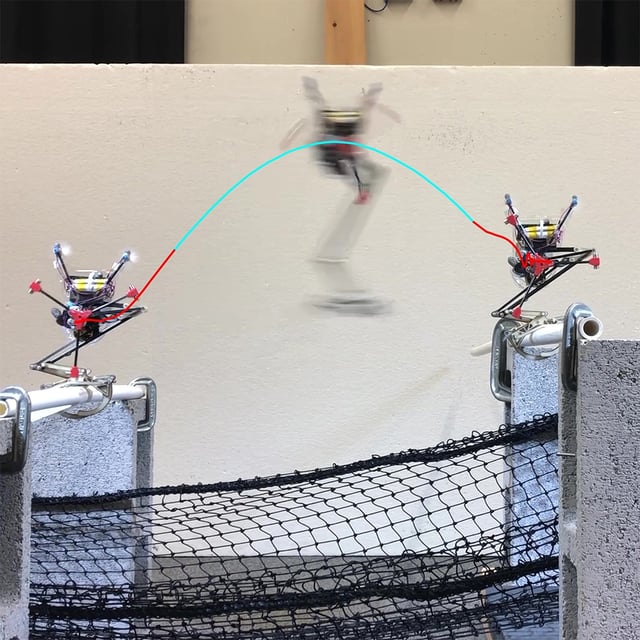 A jumping robot with one leg leaps from one PVC pipe to another. A black net is strung below it.